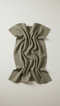 Linen throw blanket in muted olive