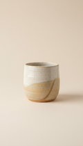 Hand-thrown ceramic mug with tactile glaze
