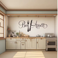 Bon Appetit wall sticker with fork and knife design displayed on a kitchen wall above white cabinets